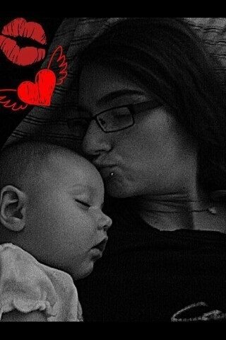 Bowling mom kissing baby