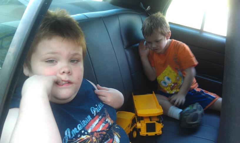 Dawn Cullins boys in police car