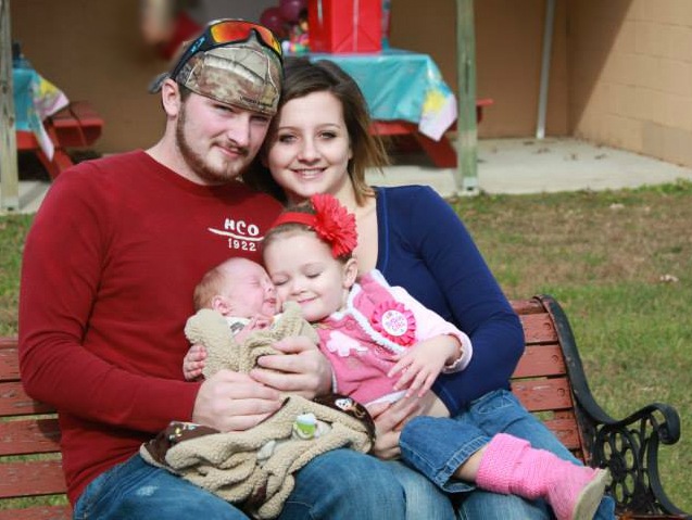 Keshia and family smiling babies