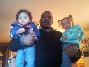 Christopher Avenger with two of his daughters. Image supplied by family.