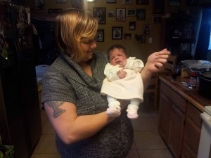 Crystal Avenger, holding her daughter Alana Jo. Image supplied by family.