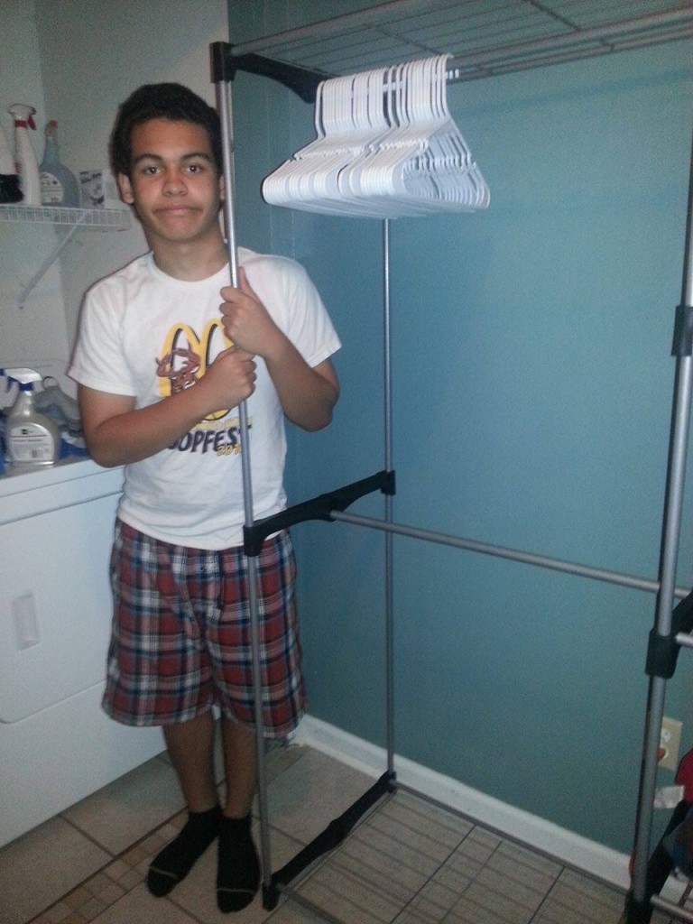 Aaron helping mom with laundry. Happy to be home. Photo supplied by family.