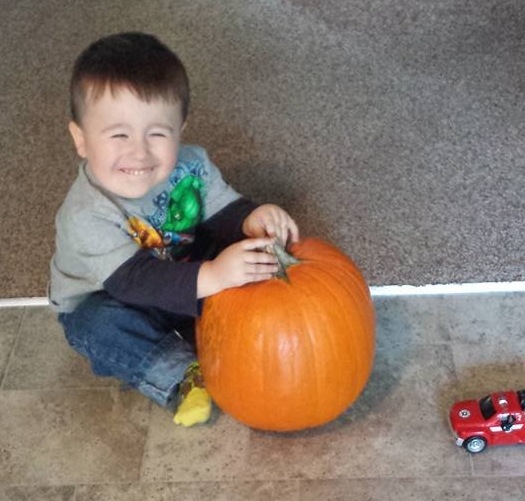 Alley son with pumpkin