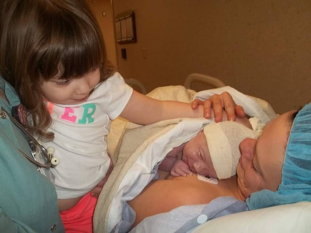 Holly with new baby and big sister