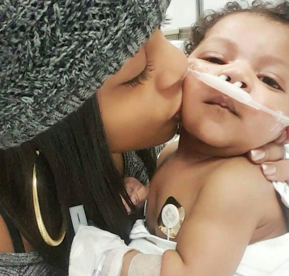 Hayden mommy kissing baby in hospital