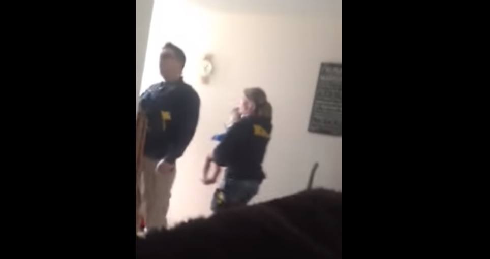 Police-Carrying-Child-out-of-home