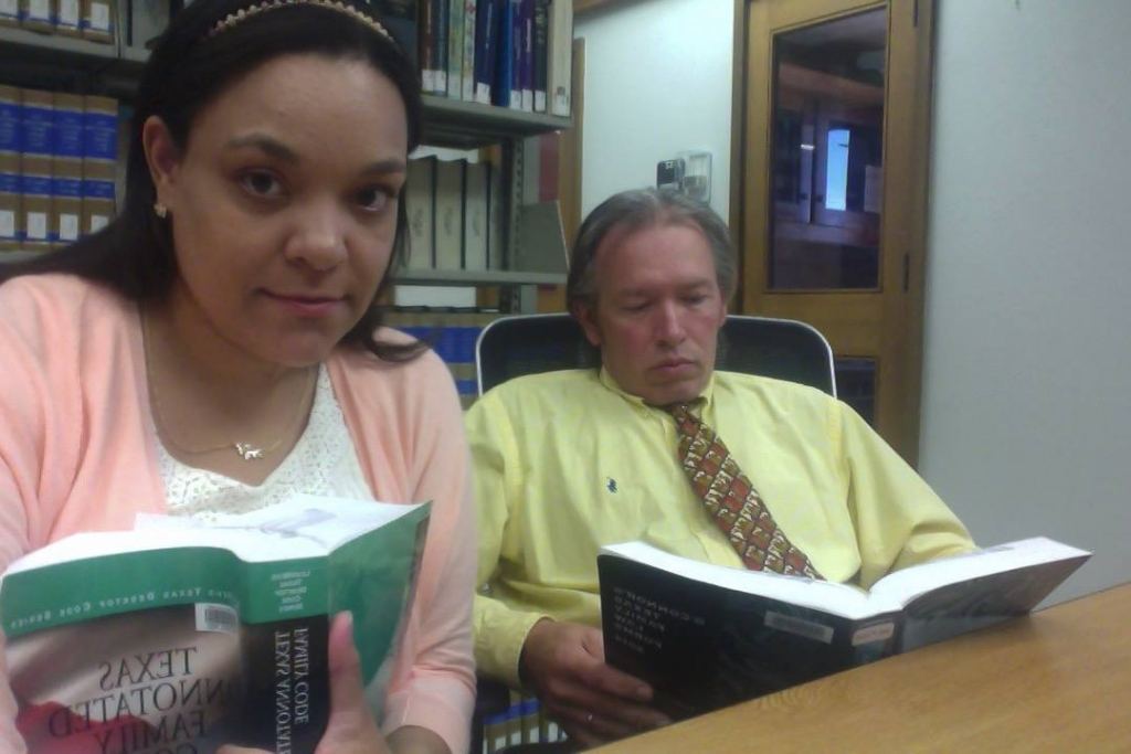Claire and William Rembis studying law at the Texas Tech Law Library, preparing for their Adversary hearing. Image from Facebook.
