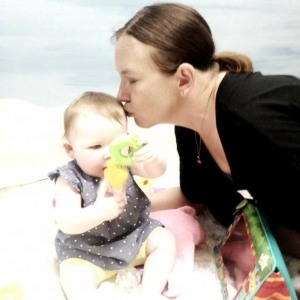 Wallace mom kissing baby