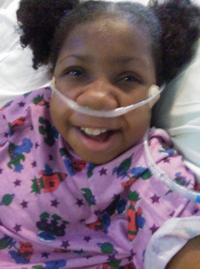 Jasmin smiling in hospital