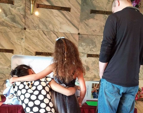 Steffen funeral family by casket