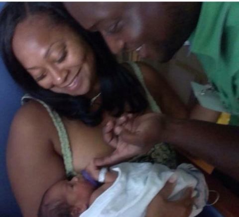 Malik as baby with grandparents