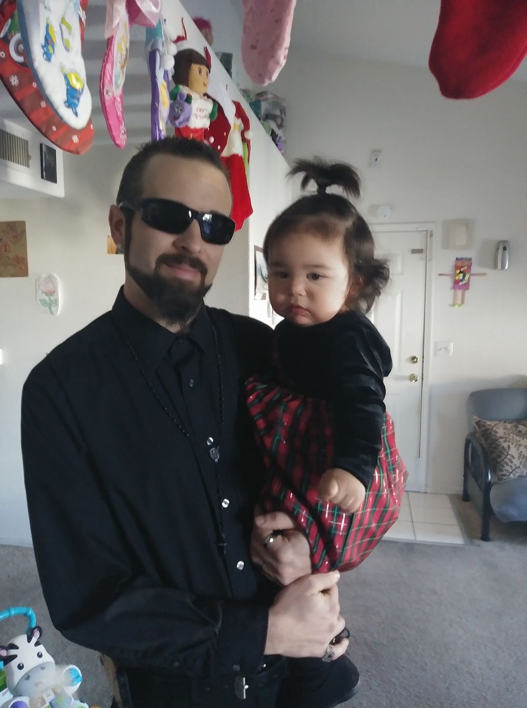 Father Jeff Shoar with baby Ny'tallieya photo