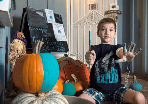 Erin Zach painting pumpkins