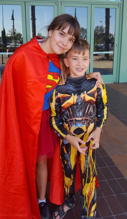 Erin kids in superhero costumes