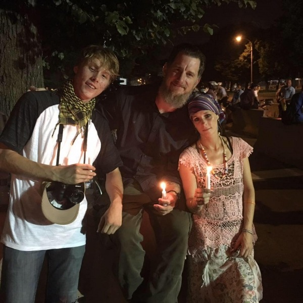 Tyler Schwab with parents candlelight